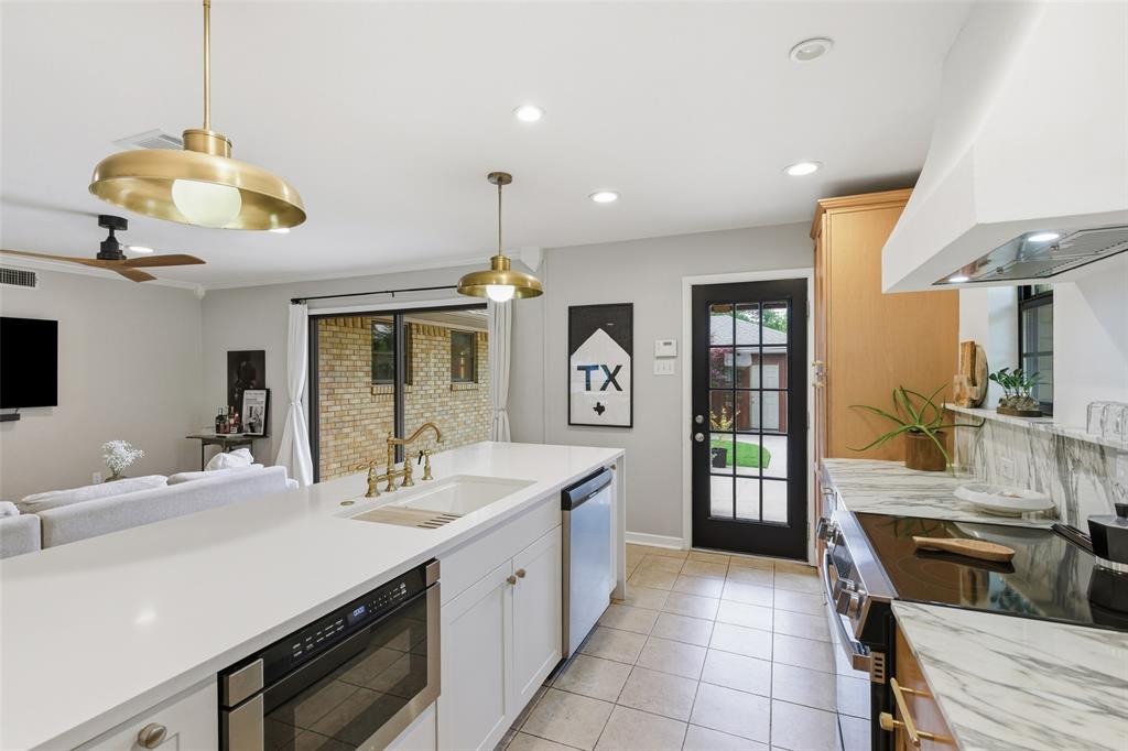 717 Ridgedale Drive Richardson, TX 75080 - Photo 14 of 40 Great view from the kitchen to living room and outdoors.