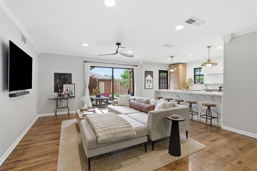 717 Ridgedale Drive Richardson, TX 75080 - Photo 2 of 40 Beautiful living room with great access to the kitchen and the back yard.