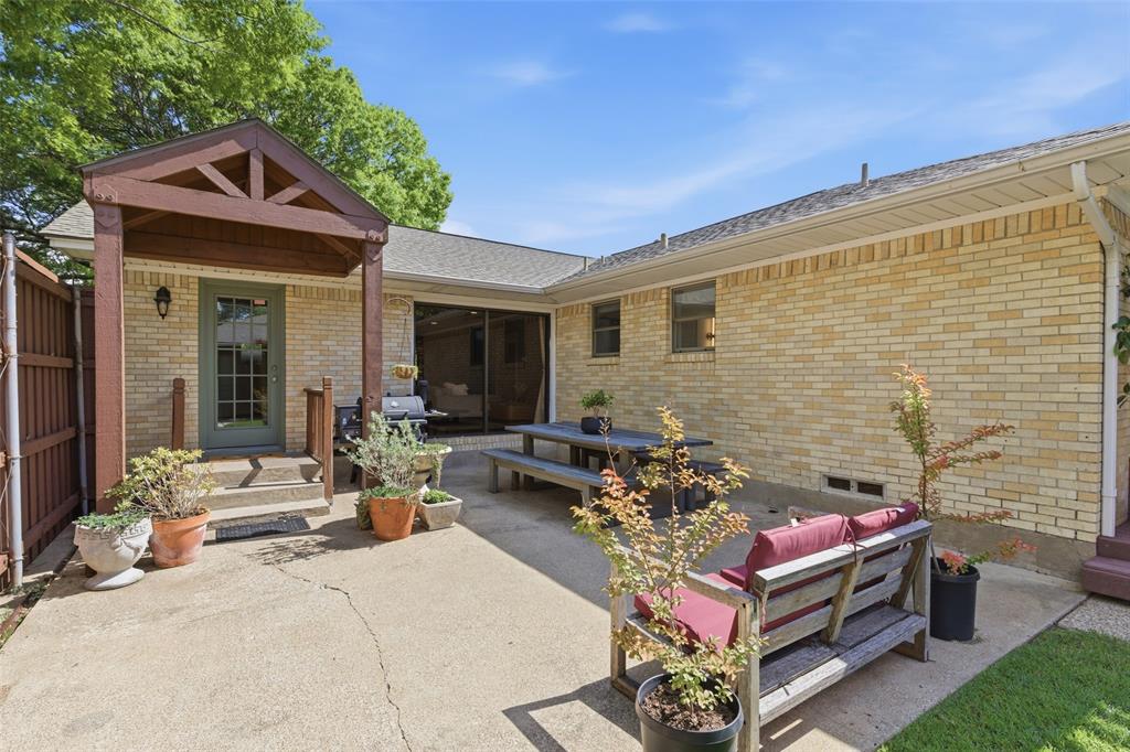 717 Ridgedale Drive Richardson, TX 75080 - Photo 30 of 40 Patio has a cute covered entrance to the home and lots of room to entertain.