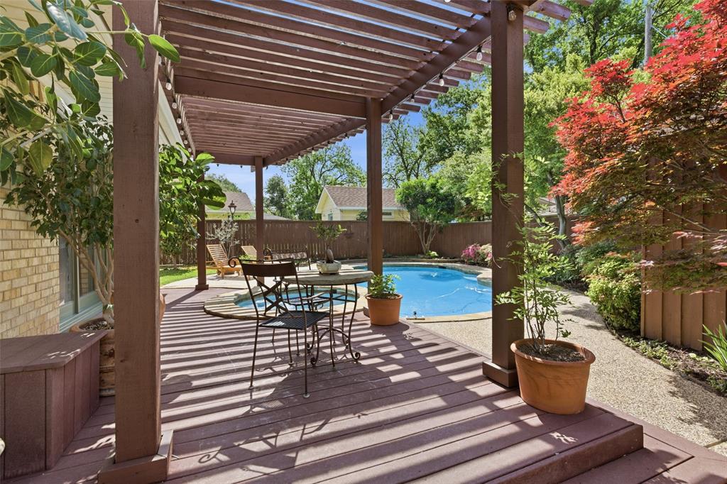 717 Ridgedale Drive Richardson, TX 75080 - Photo 32 of 40 Peaceful deck under the pergola just off of the primary bedroom