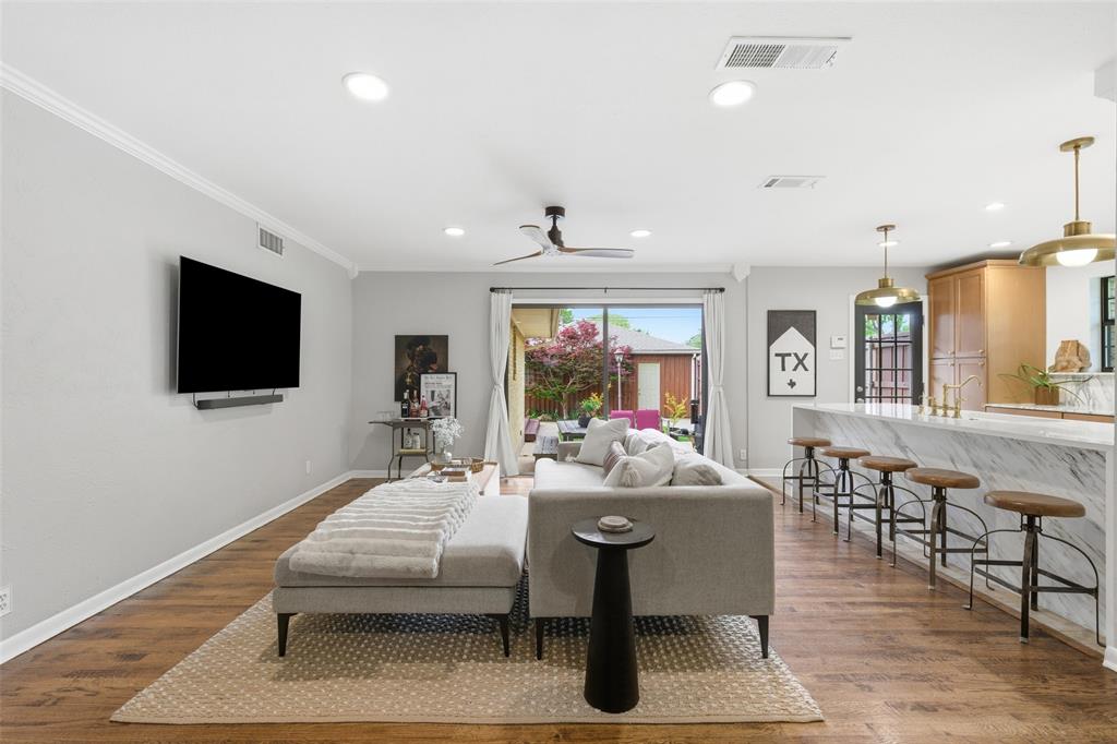 717 Ridgedale Drive Richardson, TX 75080 - Photo 4 of 40 Indoor/outdoor living is easy here with these beautiful floor to ceiling windows allowing for natural light to stream in.