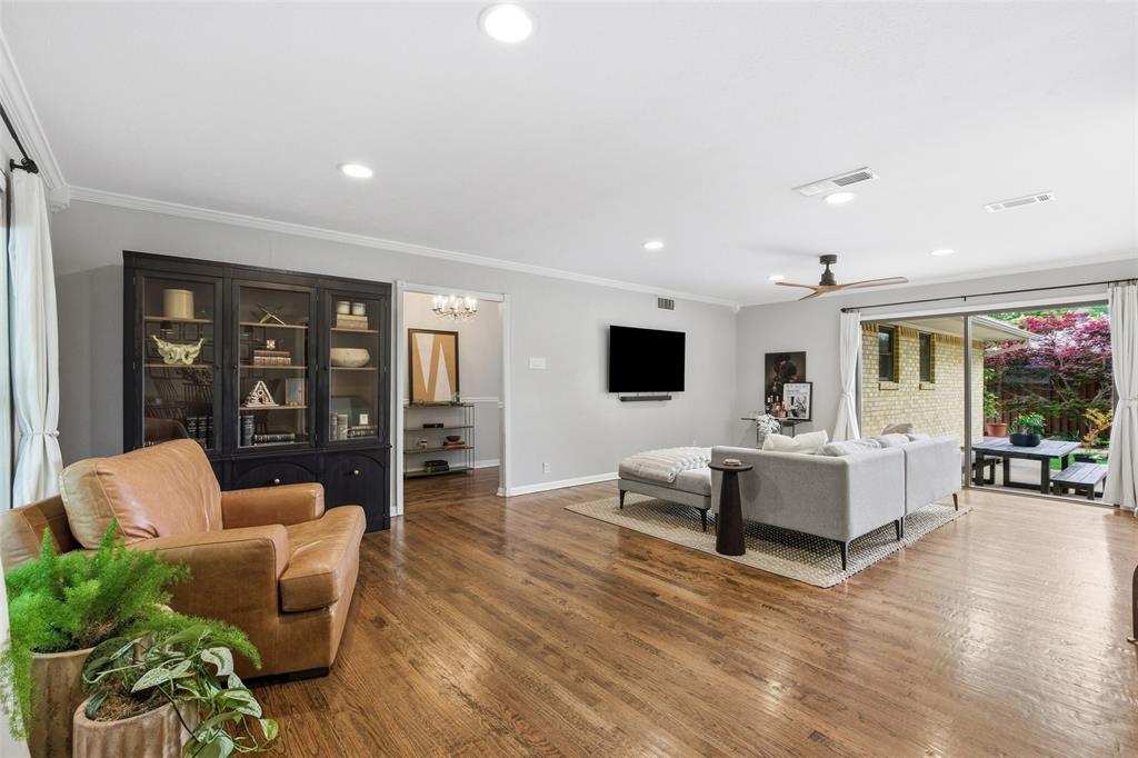 717 Ridgedale Drive Richardson, TX 75080 - Photo 6 of 40 This living room goes on for days! Perfect place for large gatherings or cozy nights in front of the TV.