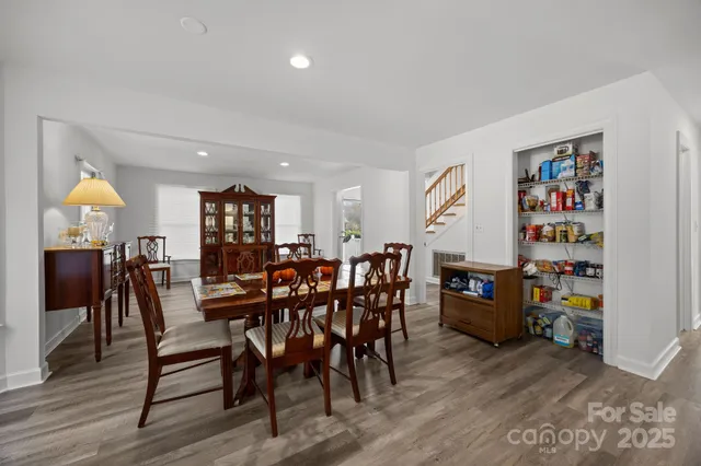 a bedroom with furniture and wooden floor