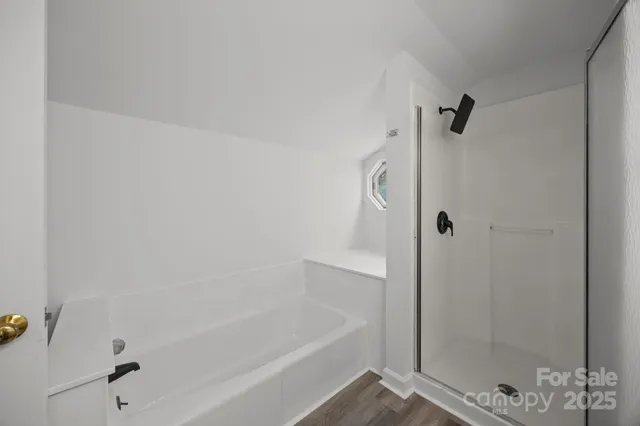 a utility room with closet and mirror