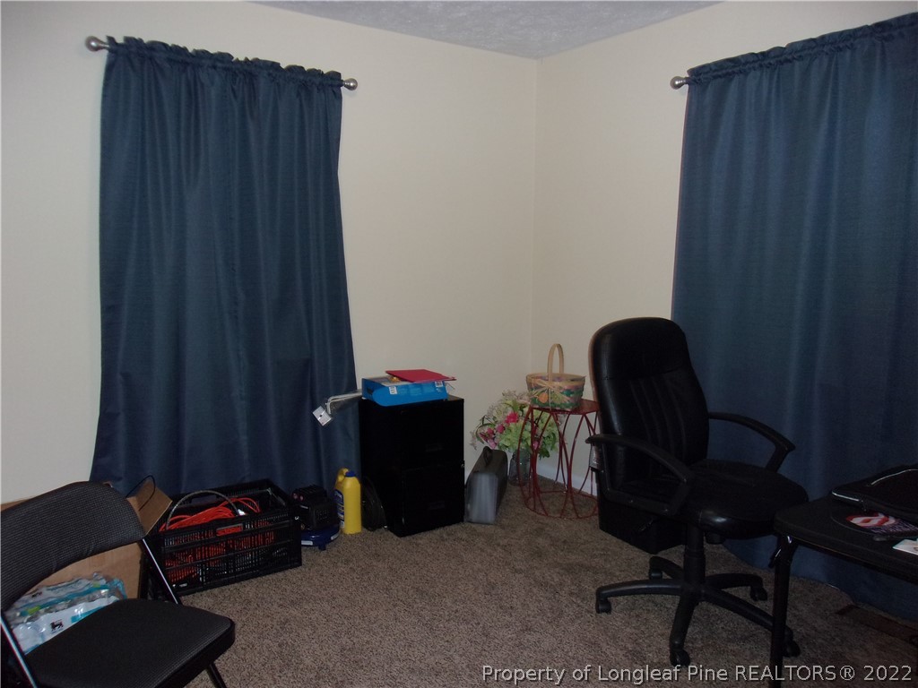 170 Wade-Stedman Road Stedman, NC 28391 - Photo 5 of 12 a room with furniture and a chair
