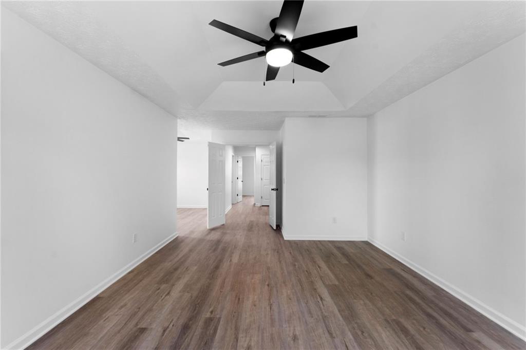 20 Mallet Pointe Street Northeast Cartersville, GA 30121 - Photo 21 of 37 wooden floor in an empty room with a window