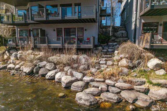 a view of a chair and tables in the patio