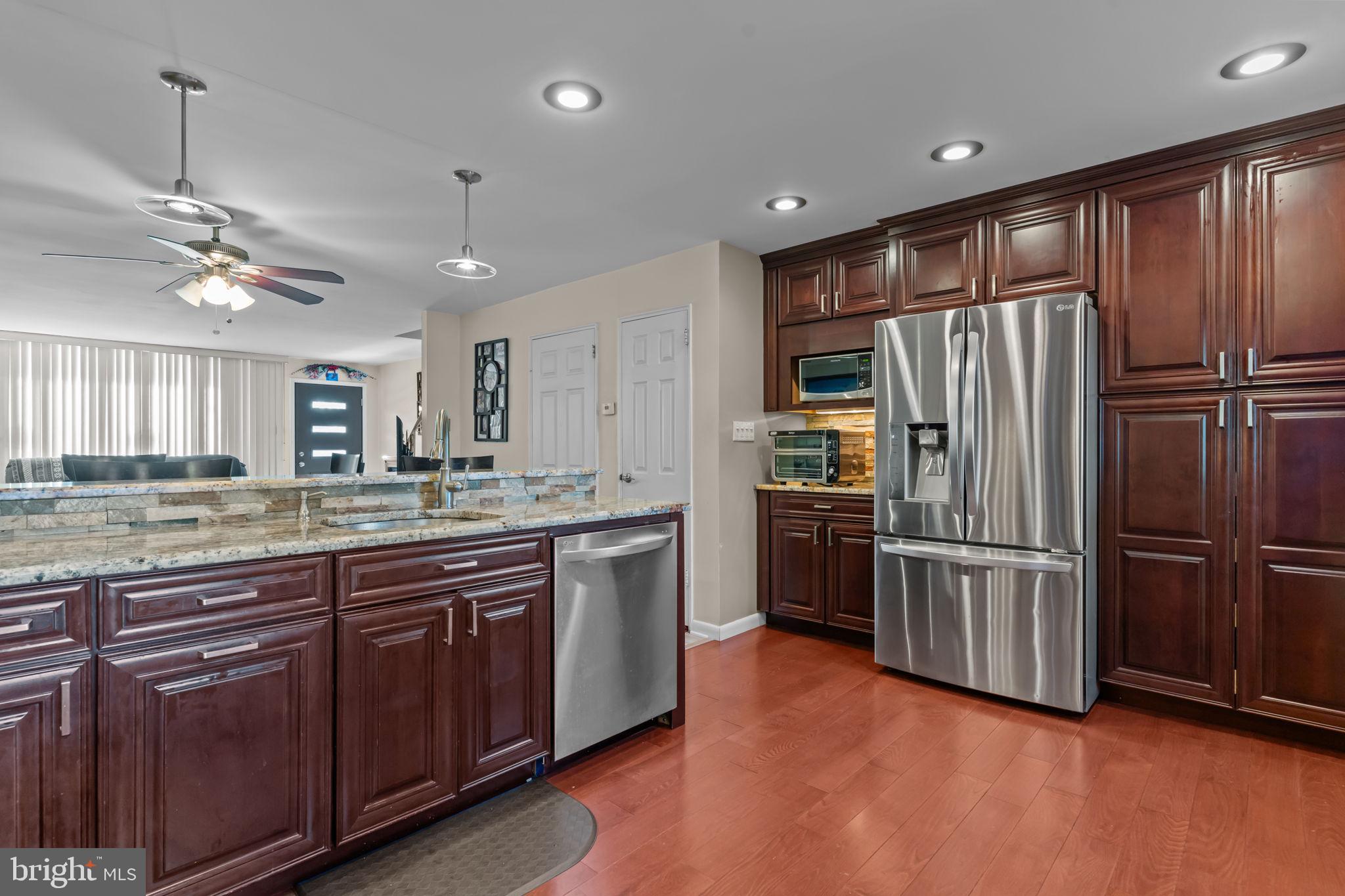 4210 Greenmount Road Philadelphia, PA 19154 - Photo 9 of 28 Kitchen w/Granite Countertops w/bar stools