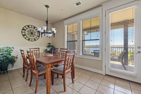 a view of a dining room with furniture window and outside view