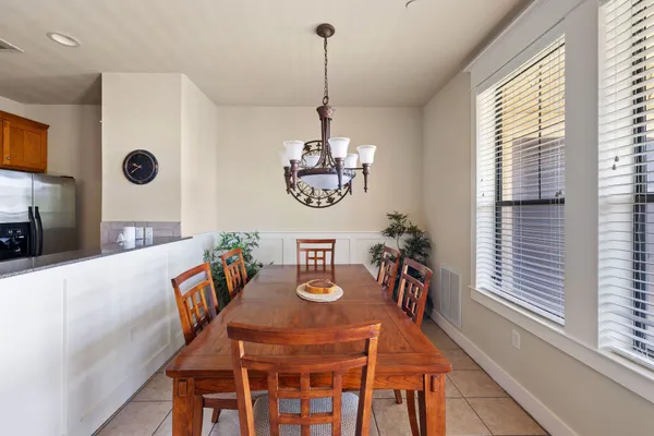 a view of a dining room with furniture window and outside view
