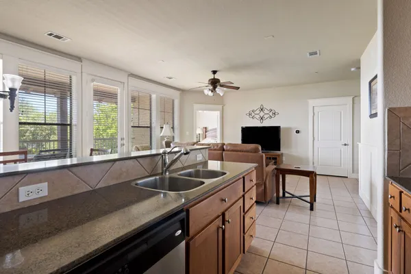 a kitchen with a sink and a refrigerator