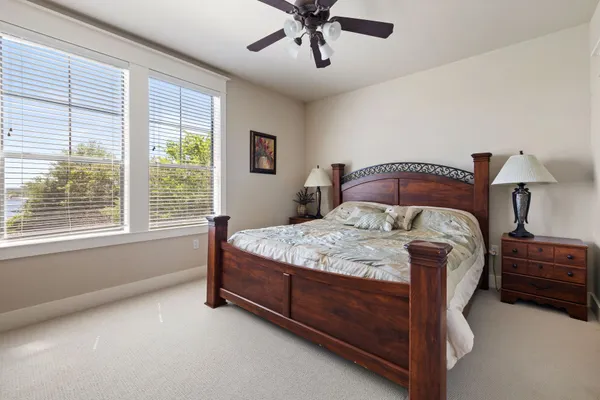 a bedroom with a bed and window