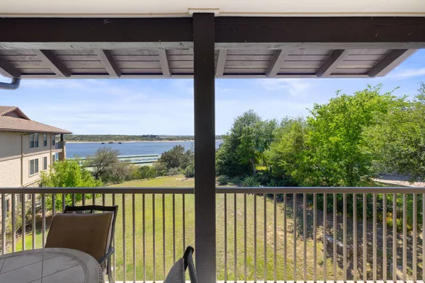 a view of a balcony with wooden floor