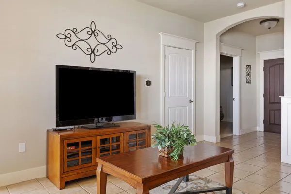 a living room with furniture and a flat screen tv