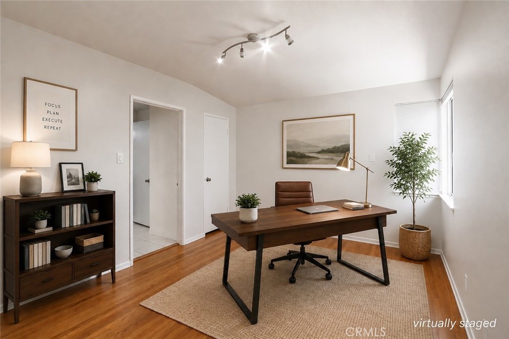 Front office space/bedroom. Virtually staged.