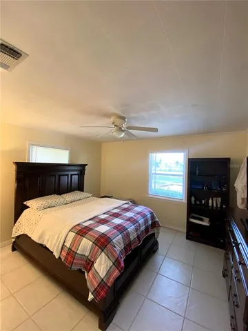 a bedroom with a bed and dresser