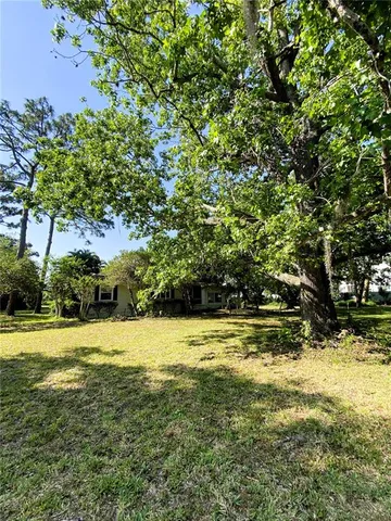a view of a yard with an outdoor space and seating area