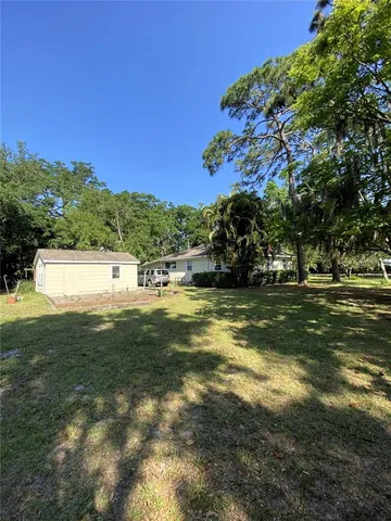 a view of a field with an ocean