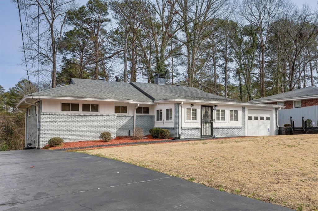 1944 Cindy Drive Decatur, GA 30032 - Photo 2 of 22 a front view of a house with a yard