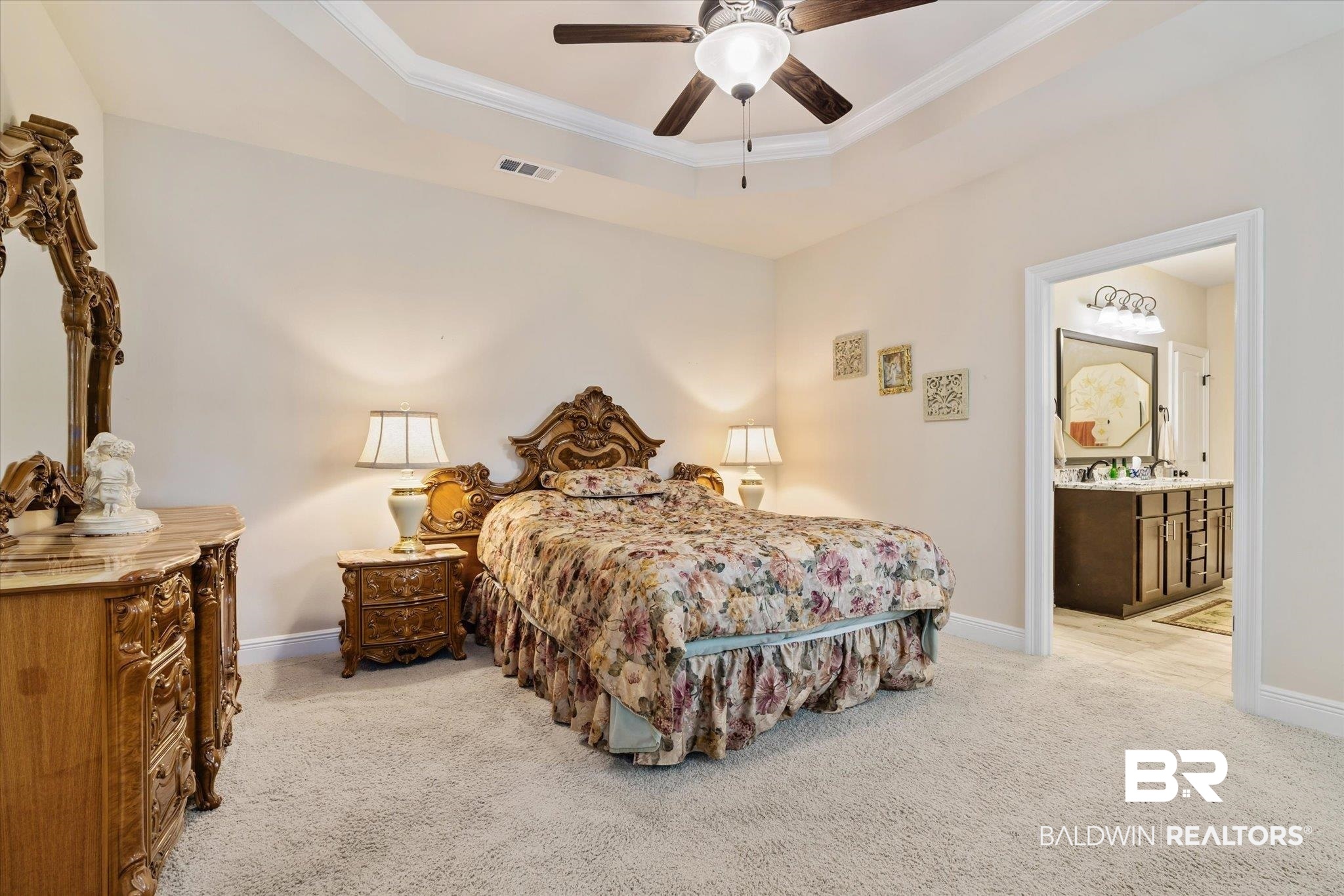 1786 Vivace Drive Foley, AL 36535 - Photo 10 of 21 Bedroom featuring ornamental molding, light colored carpet, a ceiling fan, ensuite bath, and a raised ceiling