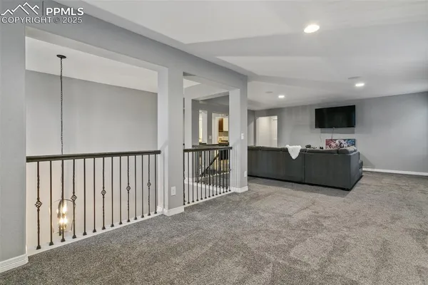 a view of a livingroom with furniture and a flat screen tv