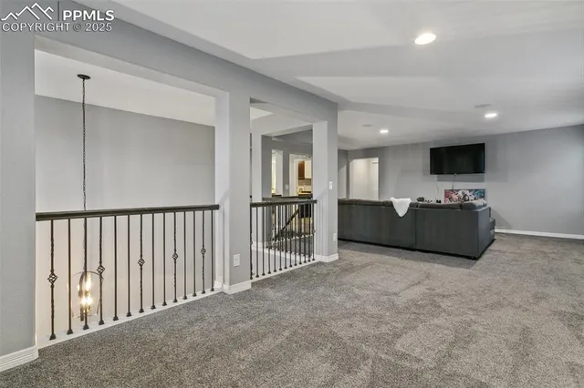 a view of a livingroom with furniture and a flat screen tv