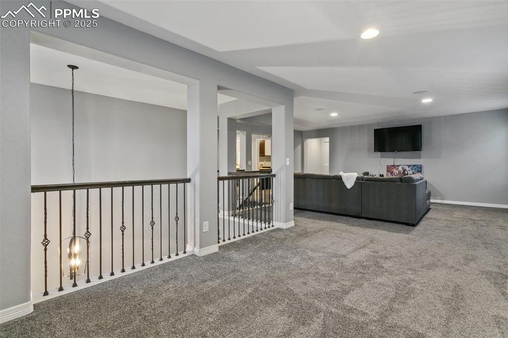 9632 Emerald Vista Drive Peyton, CO 80831 - Photo 19 of 45 a view of a livingroom with furniture and a flat screen tv