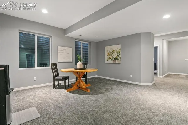 a view of a livingroom with furniture and a window