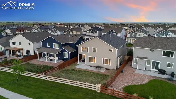 an aerial view of a house with a garden