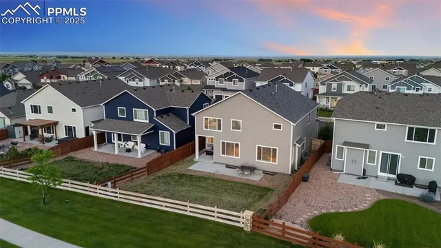 an aerial view of a house with a garden
