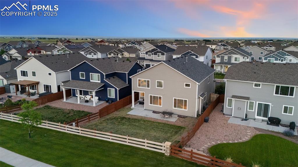 9632 Emerald Vista Drive Peyton, CO 80831 - Photo 44 of 45 an aerial view of a house with a garden
