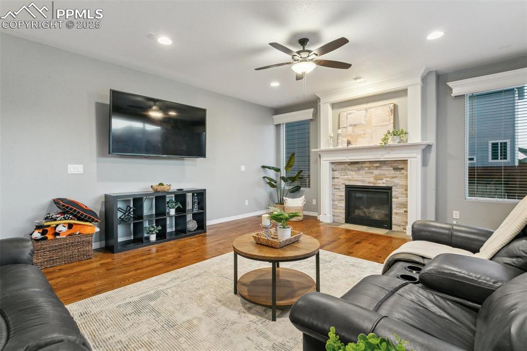 9632 Emerald Vista Drive Peyton, CO 80831 - Photo 8 of 45 a living room with furniture and a flat screen tv