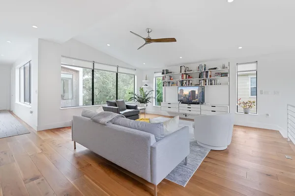 a living room with furniture and a large window