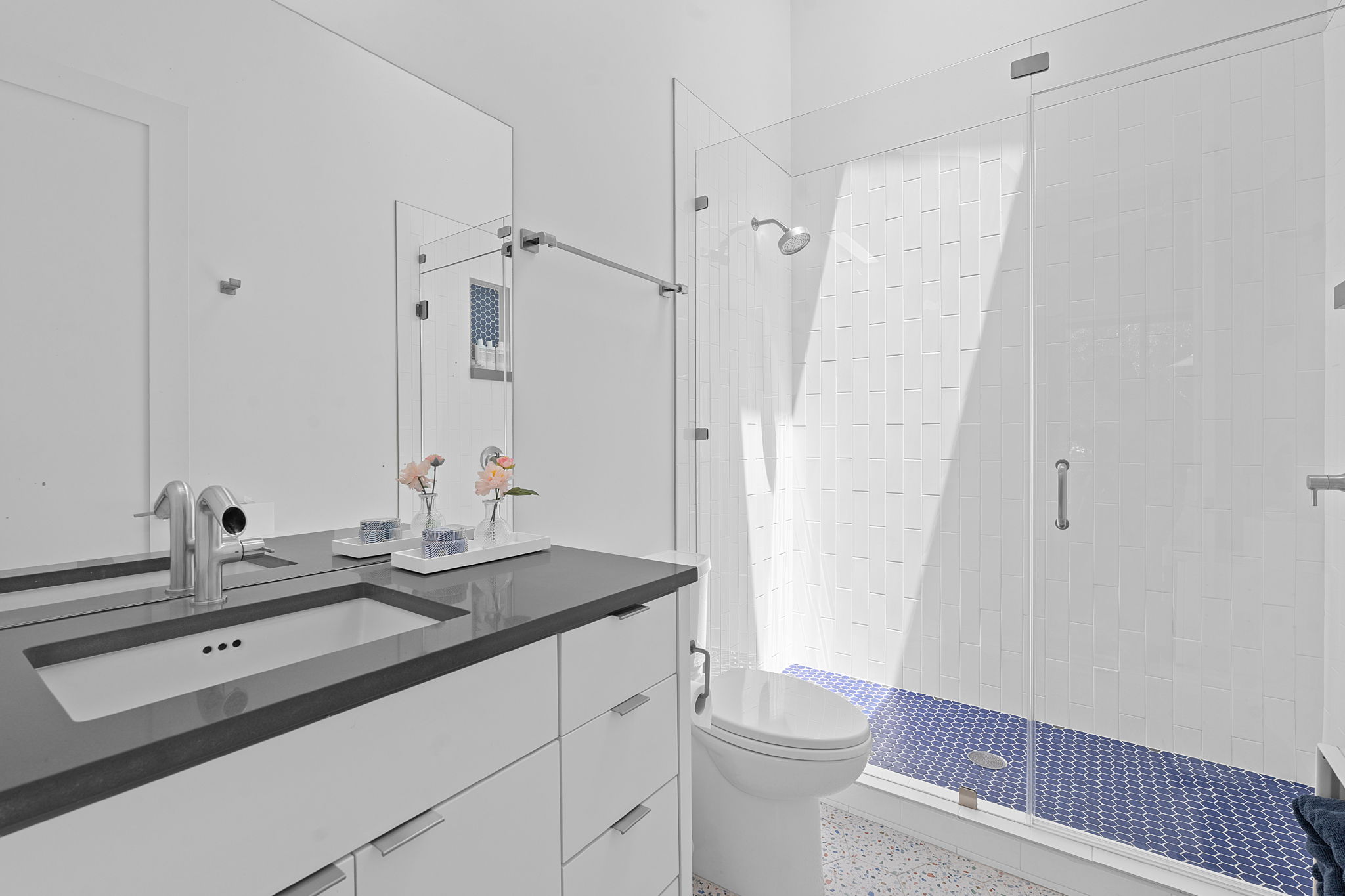 1605 Chelsea Lane Austin, TX 78704 - Photo 25 of 40 a bathroom with a sink a toilet a shower and a mirror