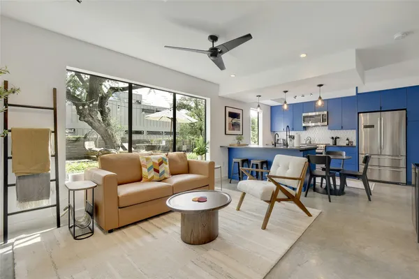 a living room with furniture and a large window
