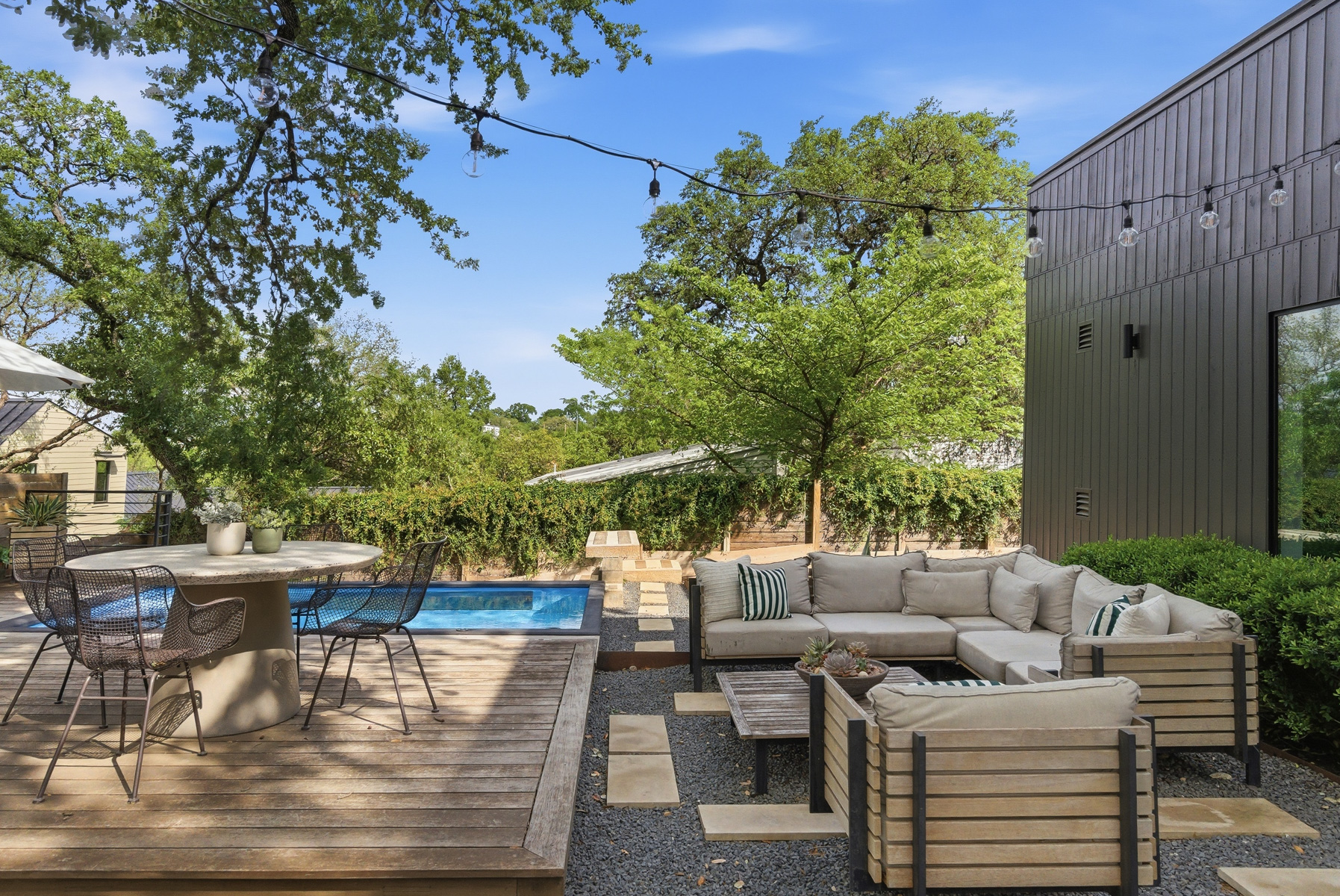 1605 Chelsea Lane Austin, TX 78704 - Photo 35 of 40 a view of a patio with couches table and chairs and potted plants