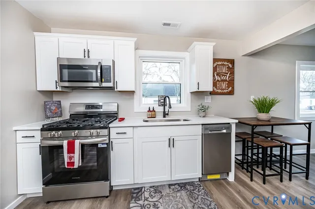 a large kitchen with cabinets
