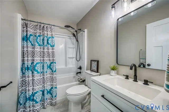 a view of a wooden fence under a large tree