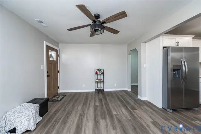a kitchen with a sink cabinets stainless steel appliances and a window