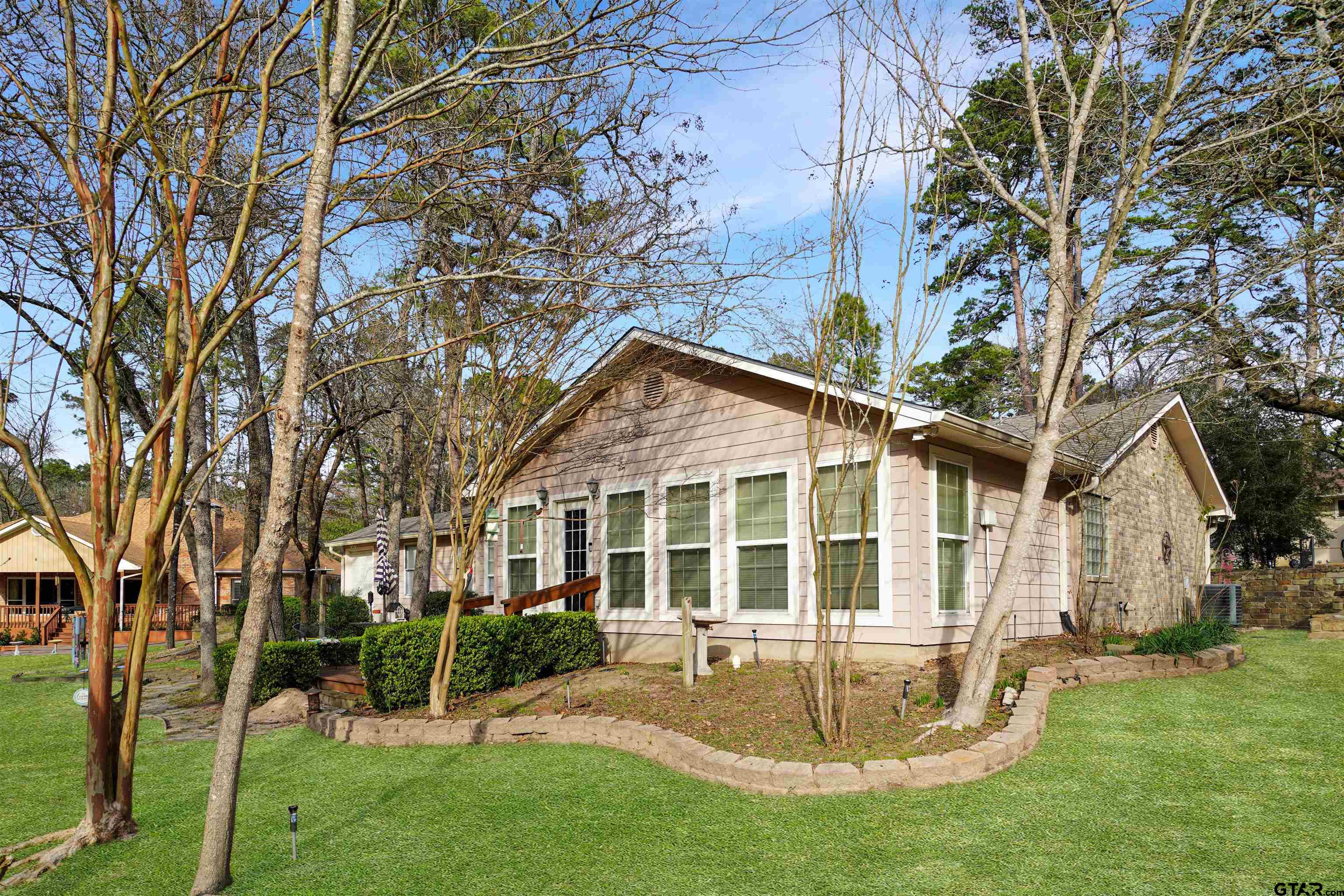 120 Rainbow Cove Holly Lake Ranch, TX 75765 - Photo 27 of 39 a view of a house with a yard and sitting area