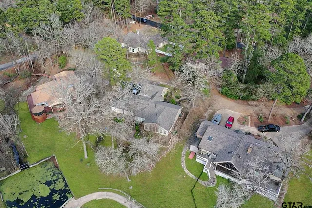 an aerial view of a house with outdoor space and street view