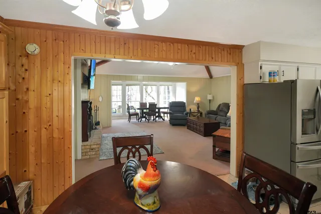 a view of a kitchen and dining room