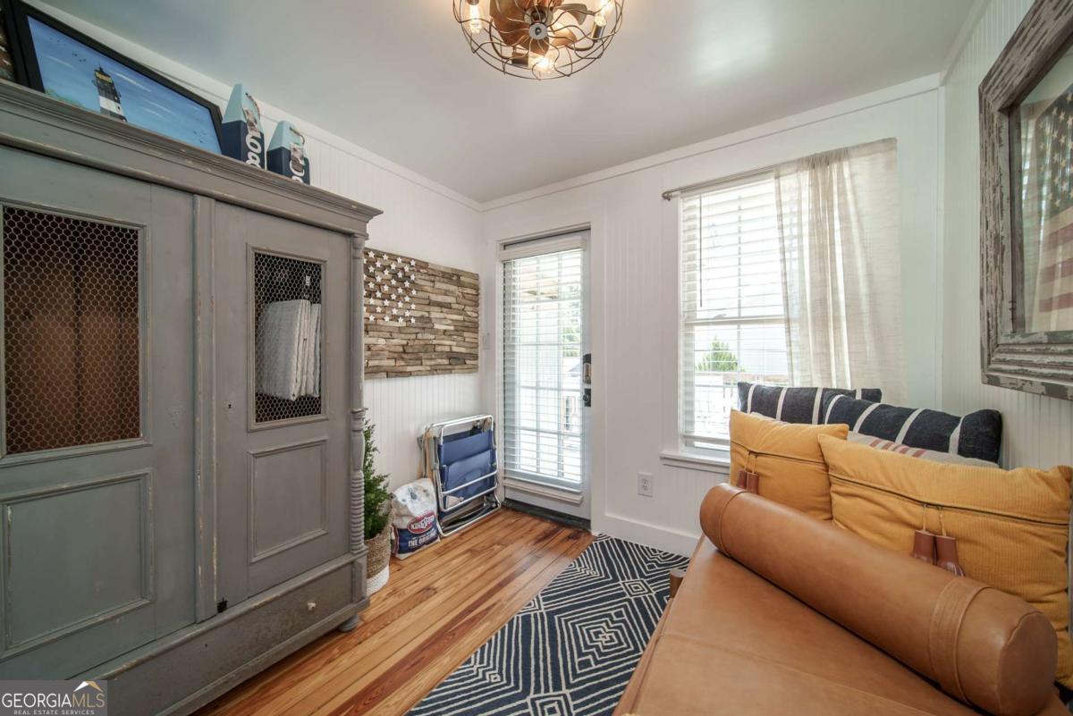 1413 2nd Avenue, Unit 2 Tybee Island, GA 31328 - Photo 20 of 30 a living room with furniture and a window