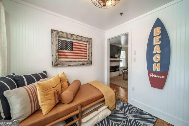 a bedroom with furniture and a wooden floor