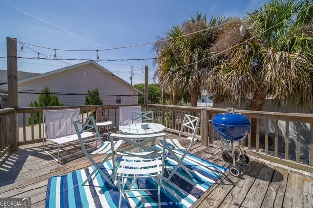 a view of a table and chairs on the roof deck