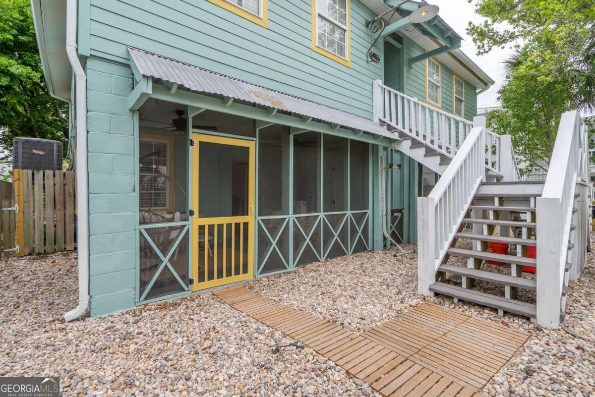 1413 2nd Avenue, Unit 2 Tybee Island, GA 31328 - Photo 4 of 30 a view of outdoor space and deck