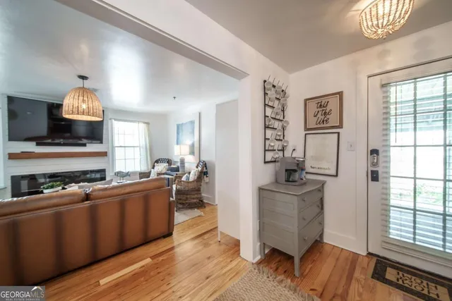a kitchen with stainless steel appliances a stove top oven and a refrigerator