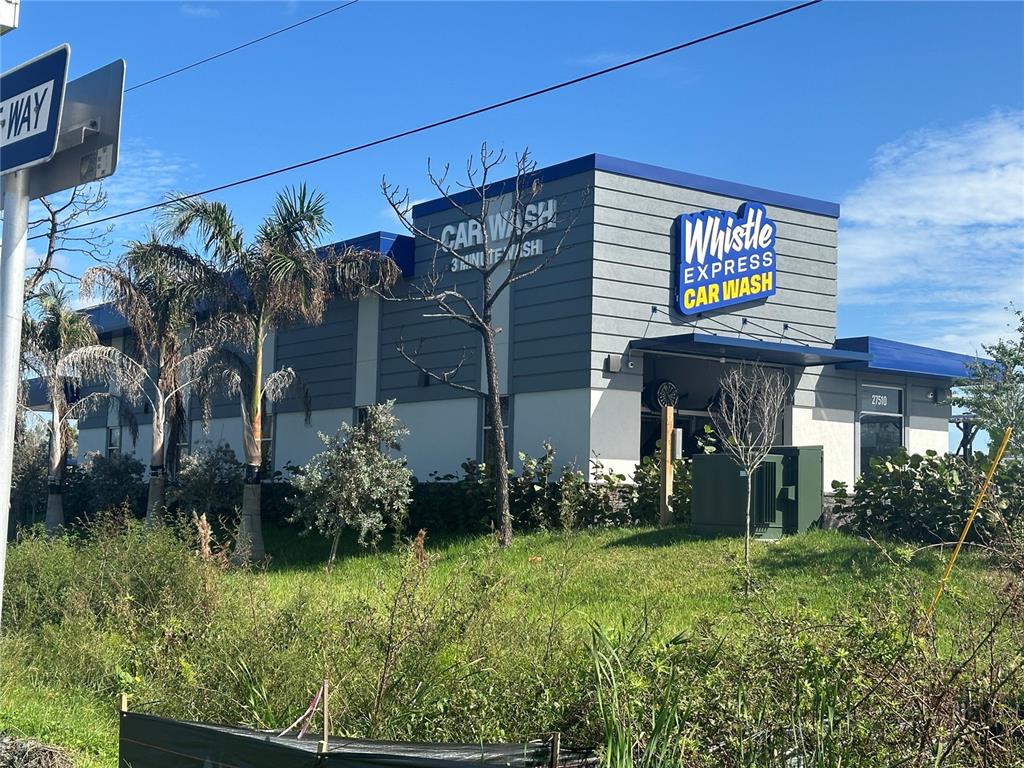 27750 Bermont Road Punta Gorda, FL 33982 - Photo 4 of 4 a view of a house with potted plants
