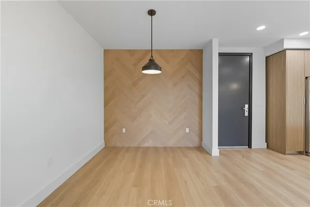 a view of a room with a ceiling fan