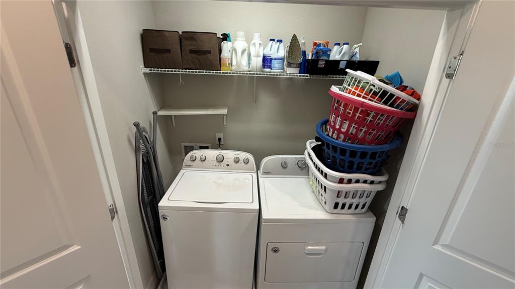 7718 Sweet Star Avenue Orlando, FL 32836 - Photo 40 of 51 a utility room with dryer and washer